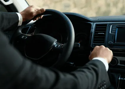 Safe driver steering a luxury vehicle in Dubai